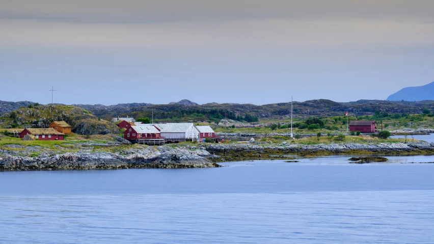 a number of small houses on land next to water