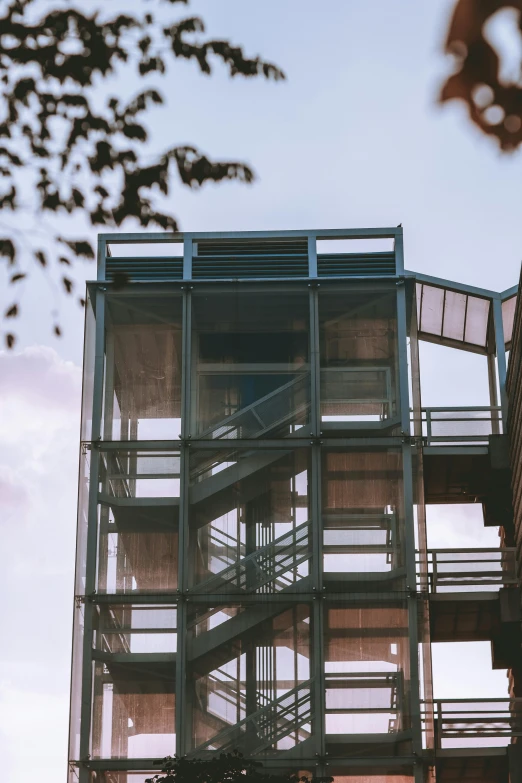 a tall building with many balconies on it