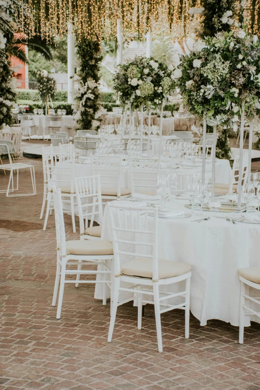 a number of tables with many chairs