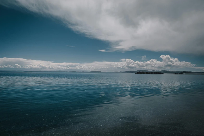 the calm water of the ocean is still as blue as it was