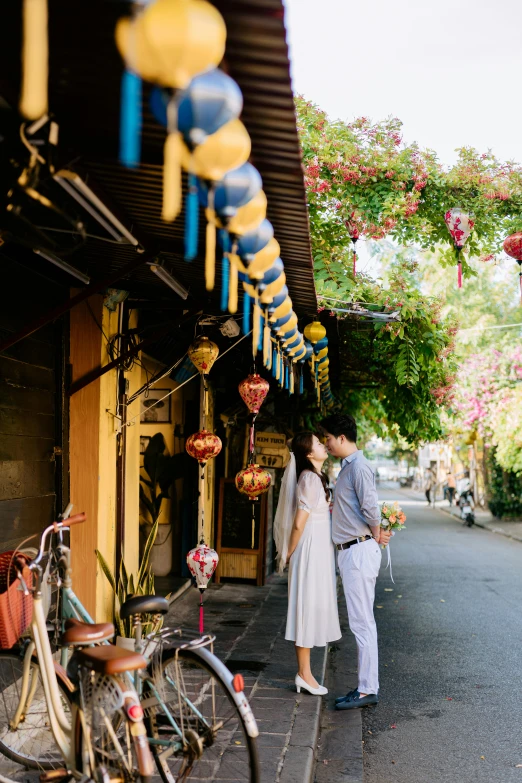 two people are standing in front of shops