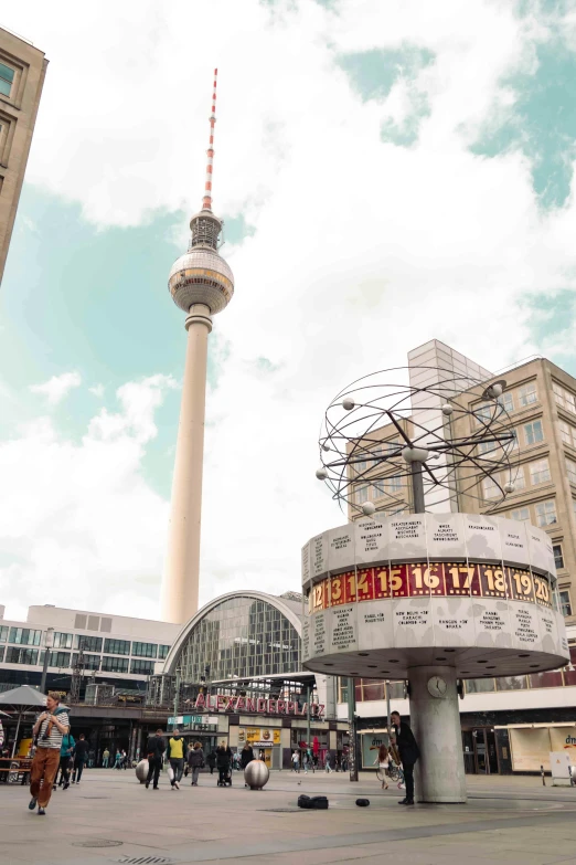 the tower is next to a large white building