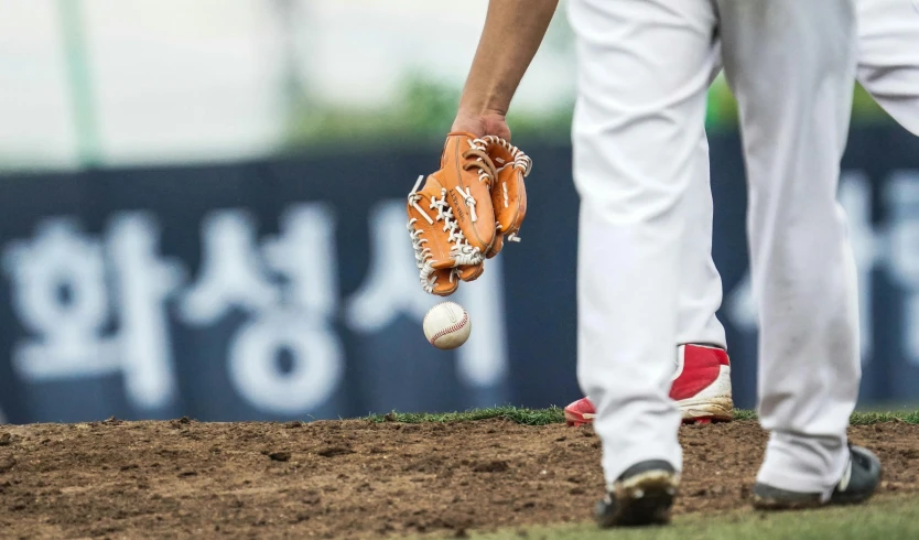 a baseball player standing on top of a field