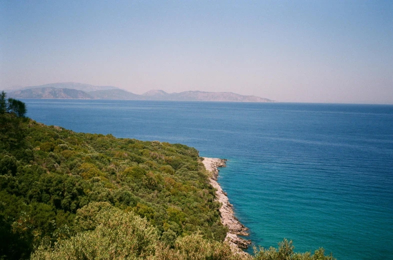 a boat is seen on the water off the coast