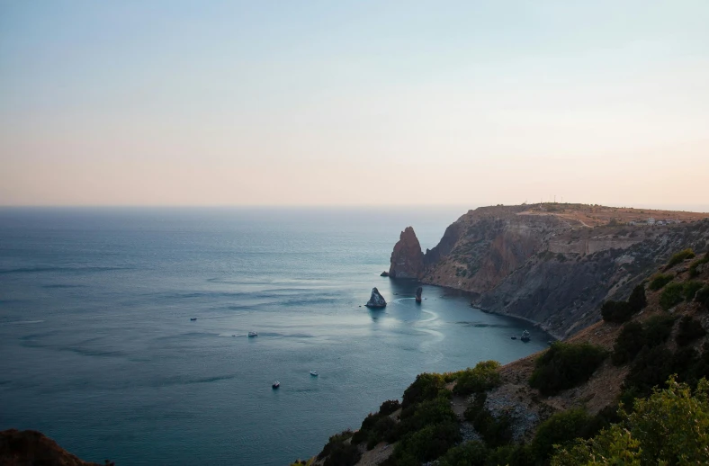 an ocean view with a boat on the water