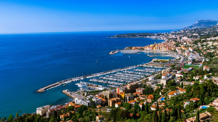 a boat marina is pictured at the edge of the water