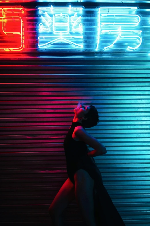 the woman is standing next to a garage door