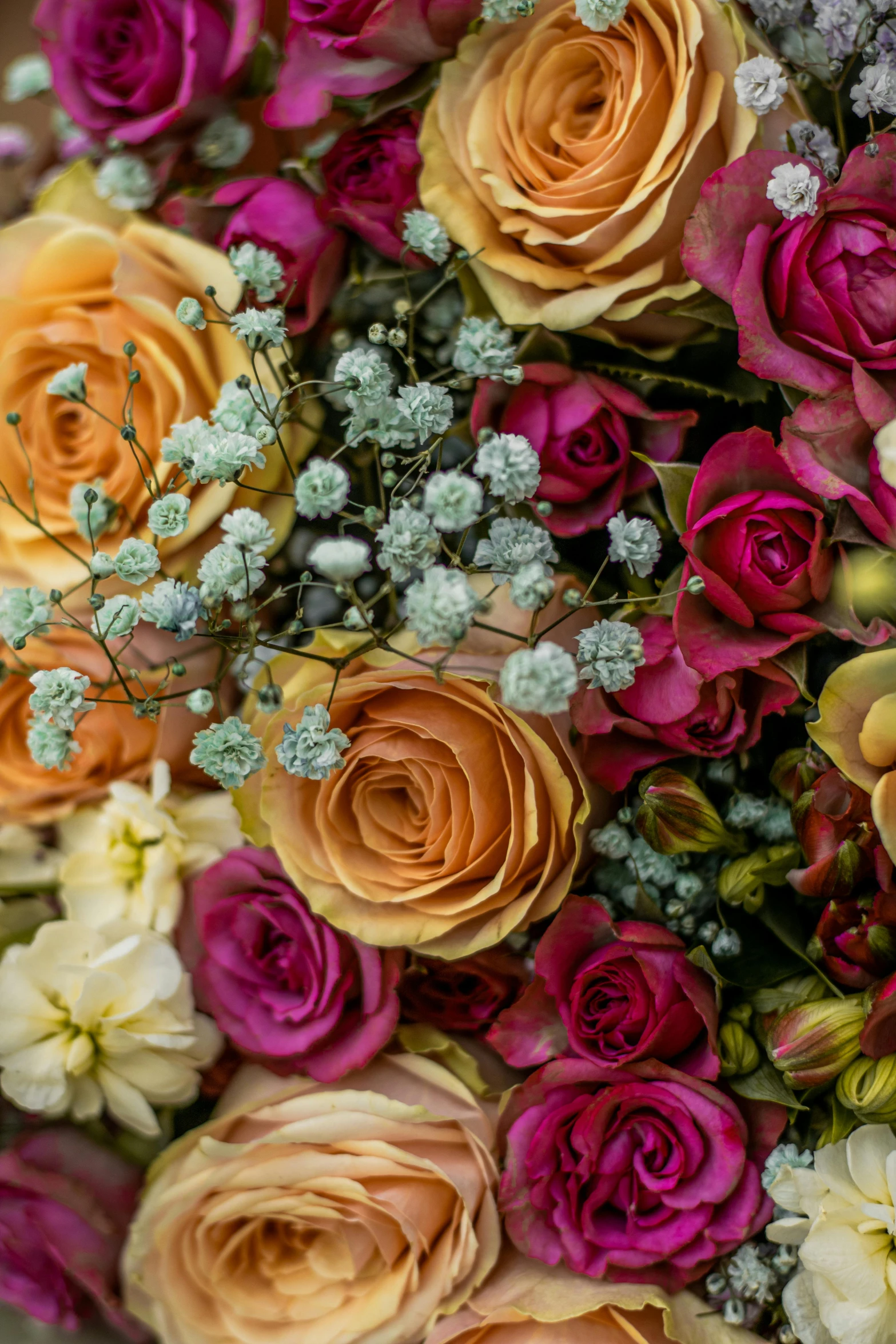 a close up of a bouquet with flowers in the middle