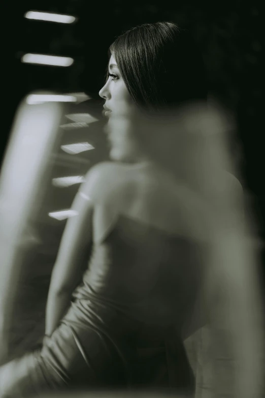 a woman wearing a short dress sitting at a desk