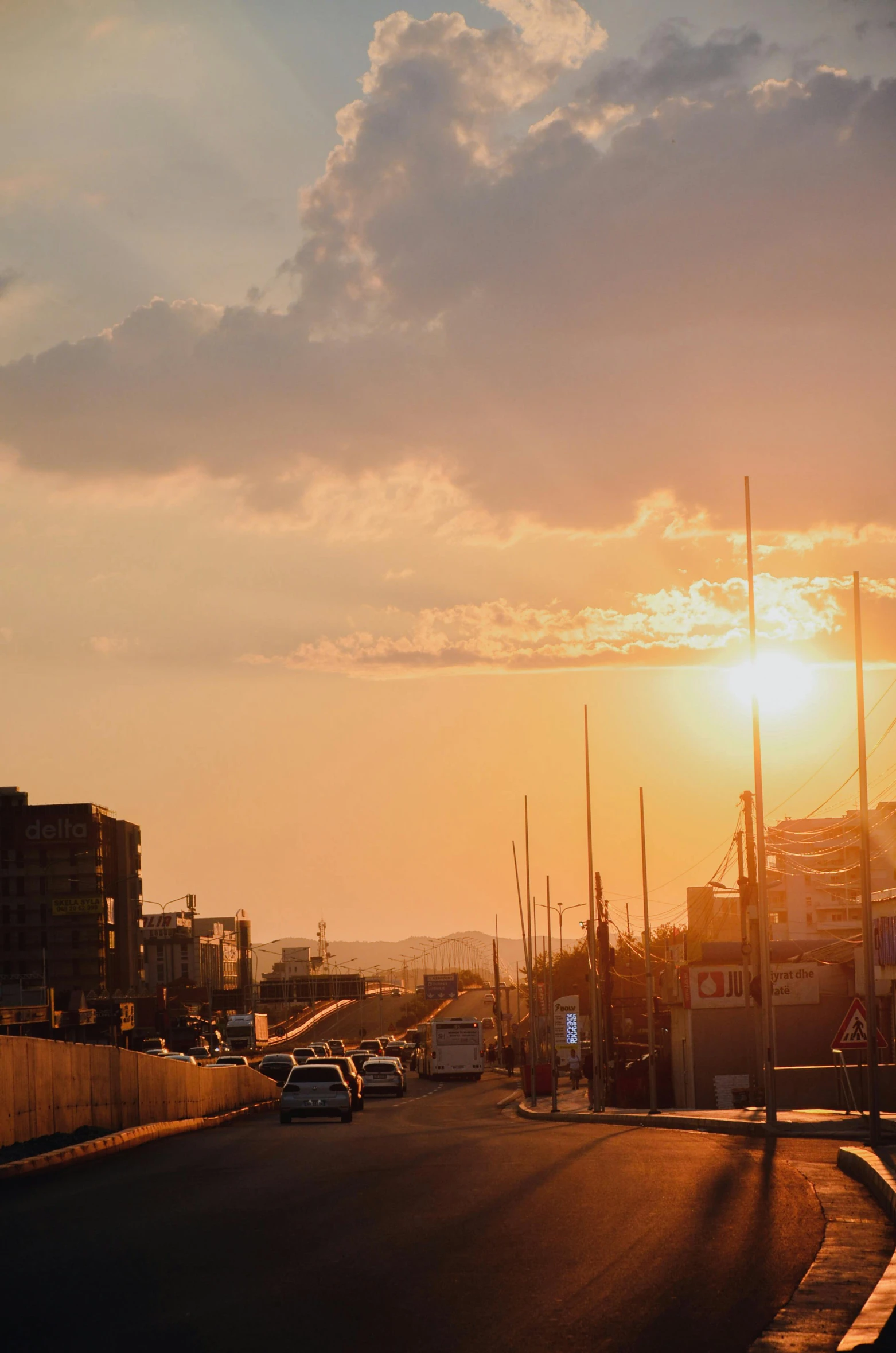 the sun rises on an empty city street