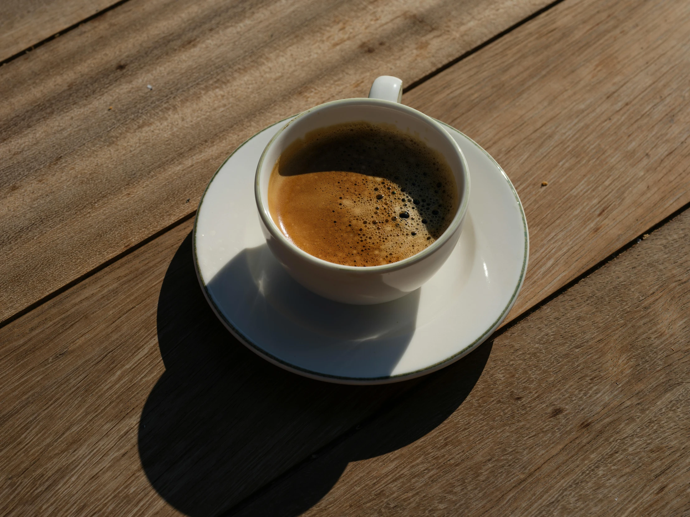 a cup of coffee sitting on top of a saucer