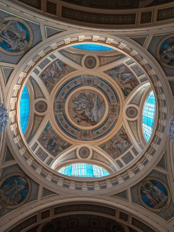 a dome shaped building has stained glass in it