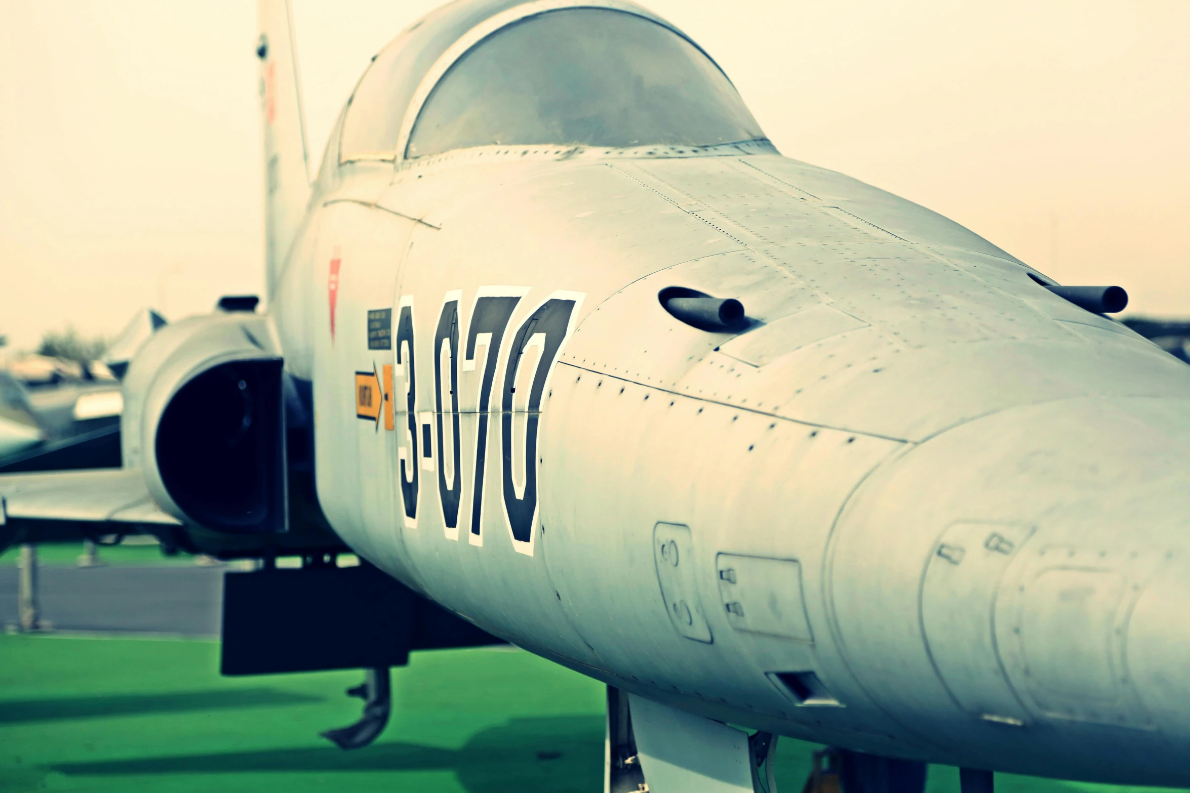 the nose view of a jet fighter plane on display