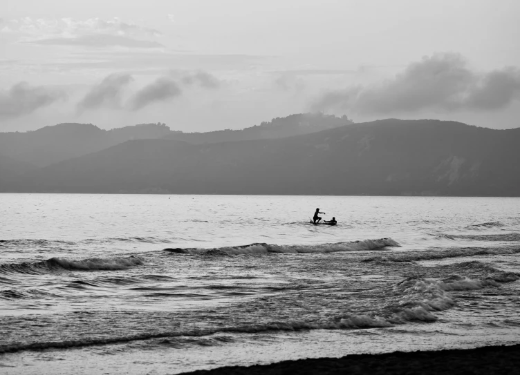 two people in a small boat on the ocean