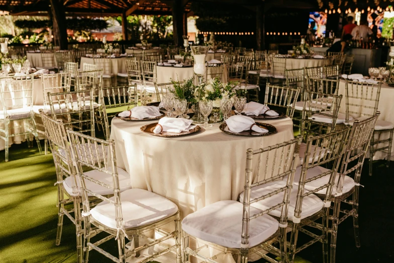 tables and chairs that have been set for an outdoor event