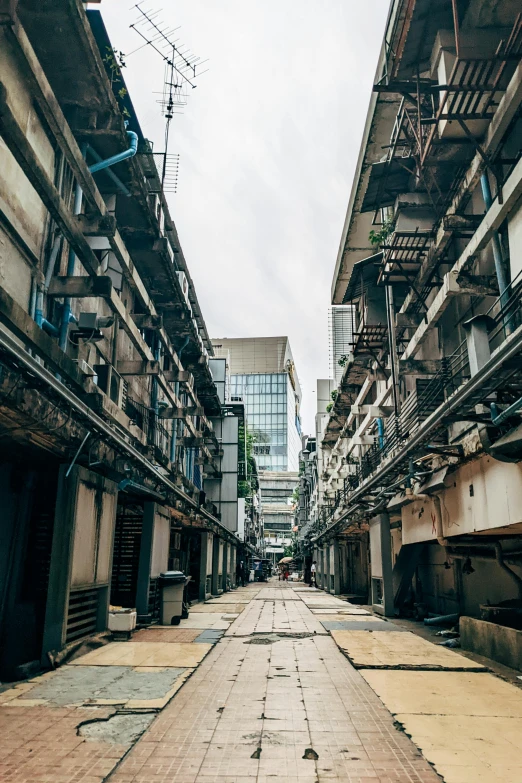 an alley way with buildings in the background