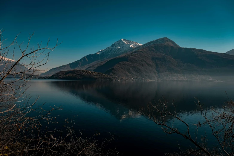 a lake with a large mountain in the background