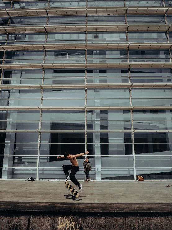 the skateboarder rides his board through the air