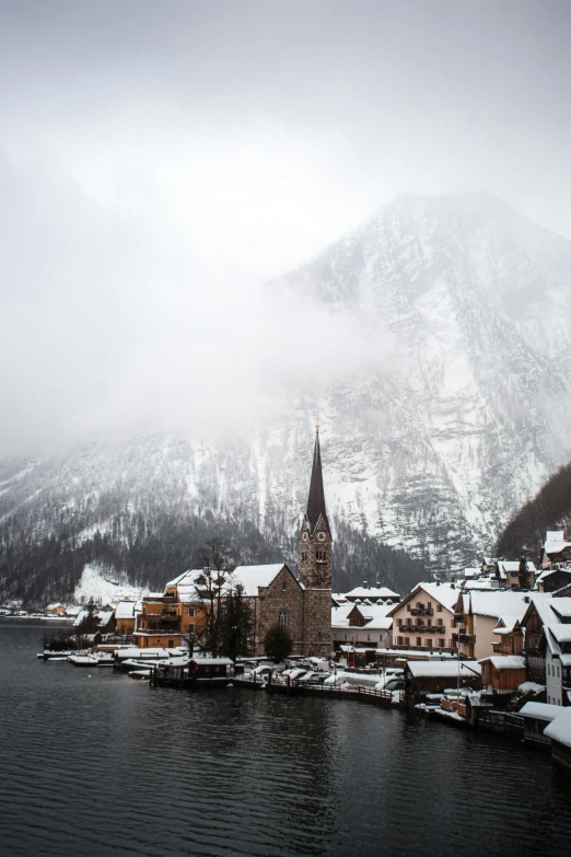 a snowy, icy lake in a small town