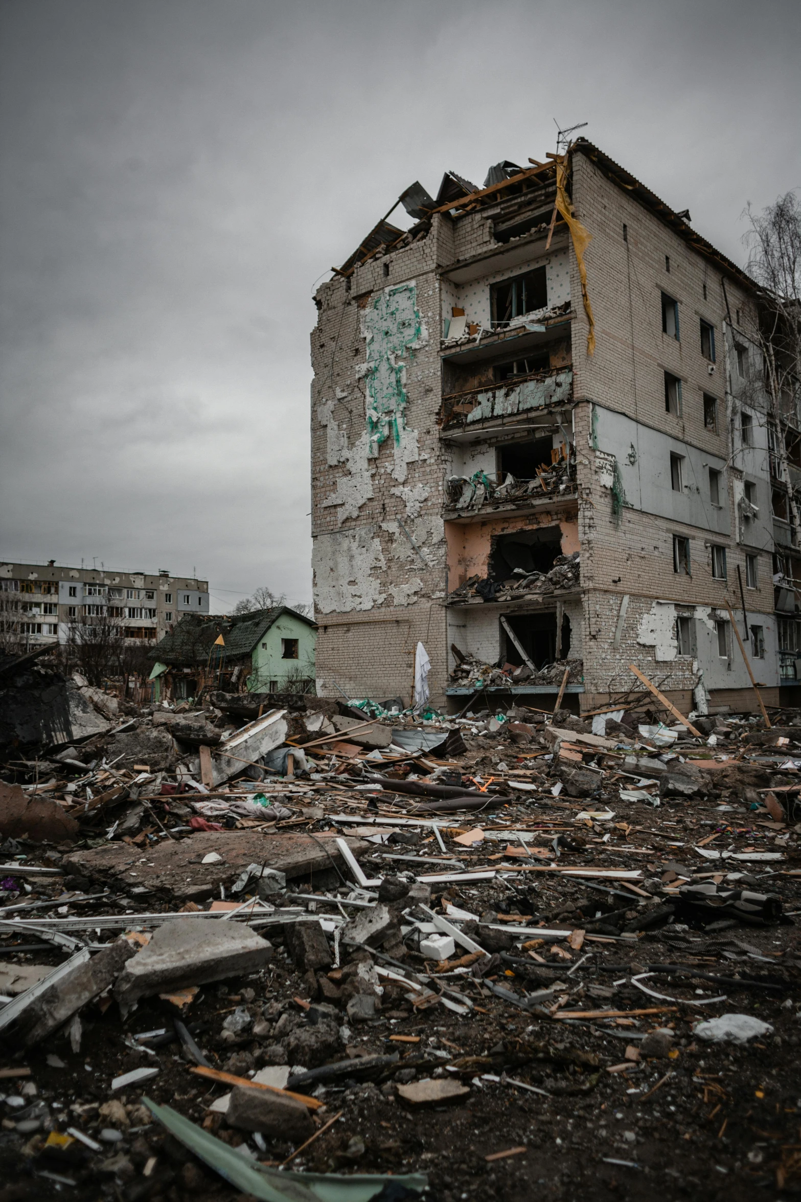 a run down building sitting in the middle of a destroyed area