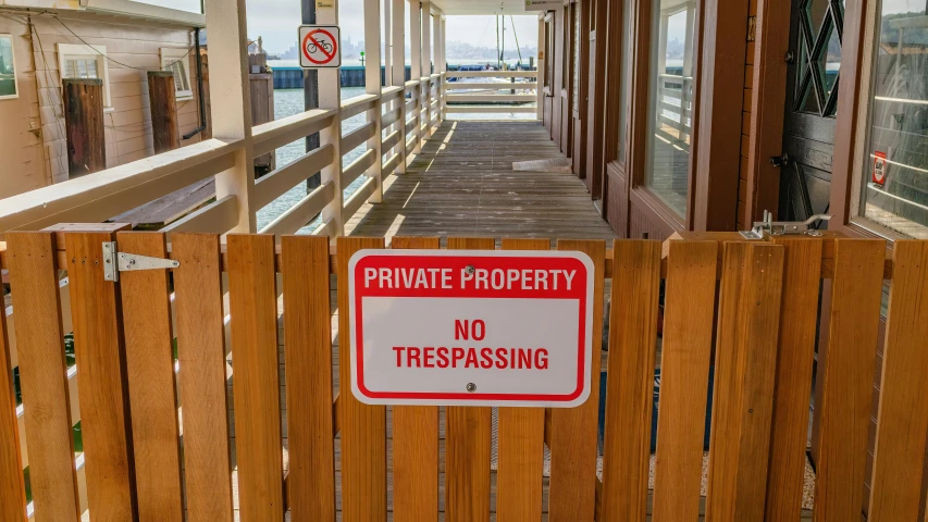 a no trespassing sign in between two posts