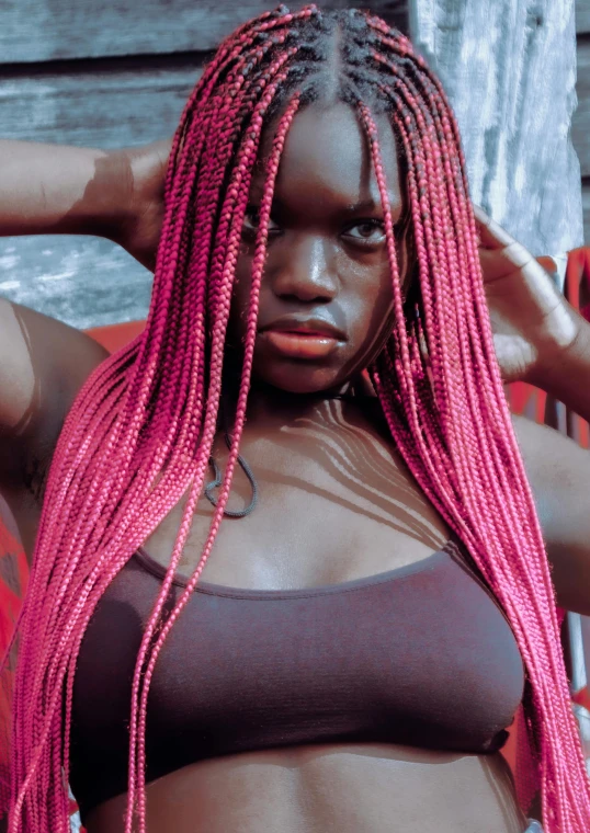 woman with pink dyed hair and brown 