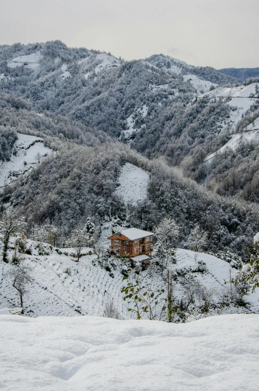 the view of some snow covered mountains from the slope