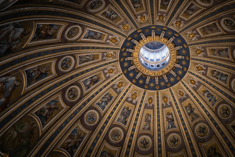 an ornate domed painting hangs from the ceiling