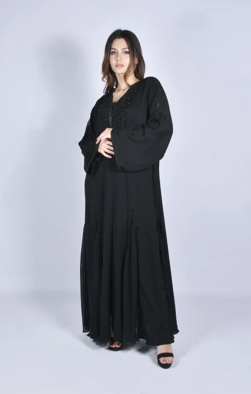 a woman wearing black in a long gown