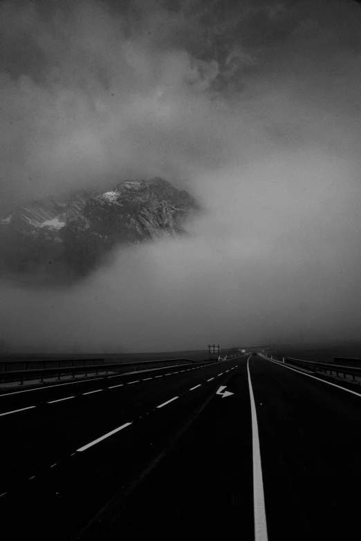 a black and white po shows the highway in the distance