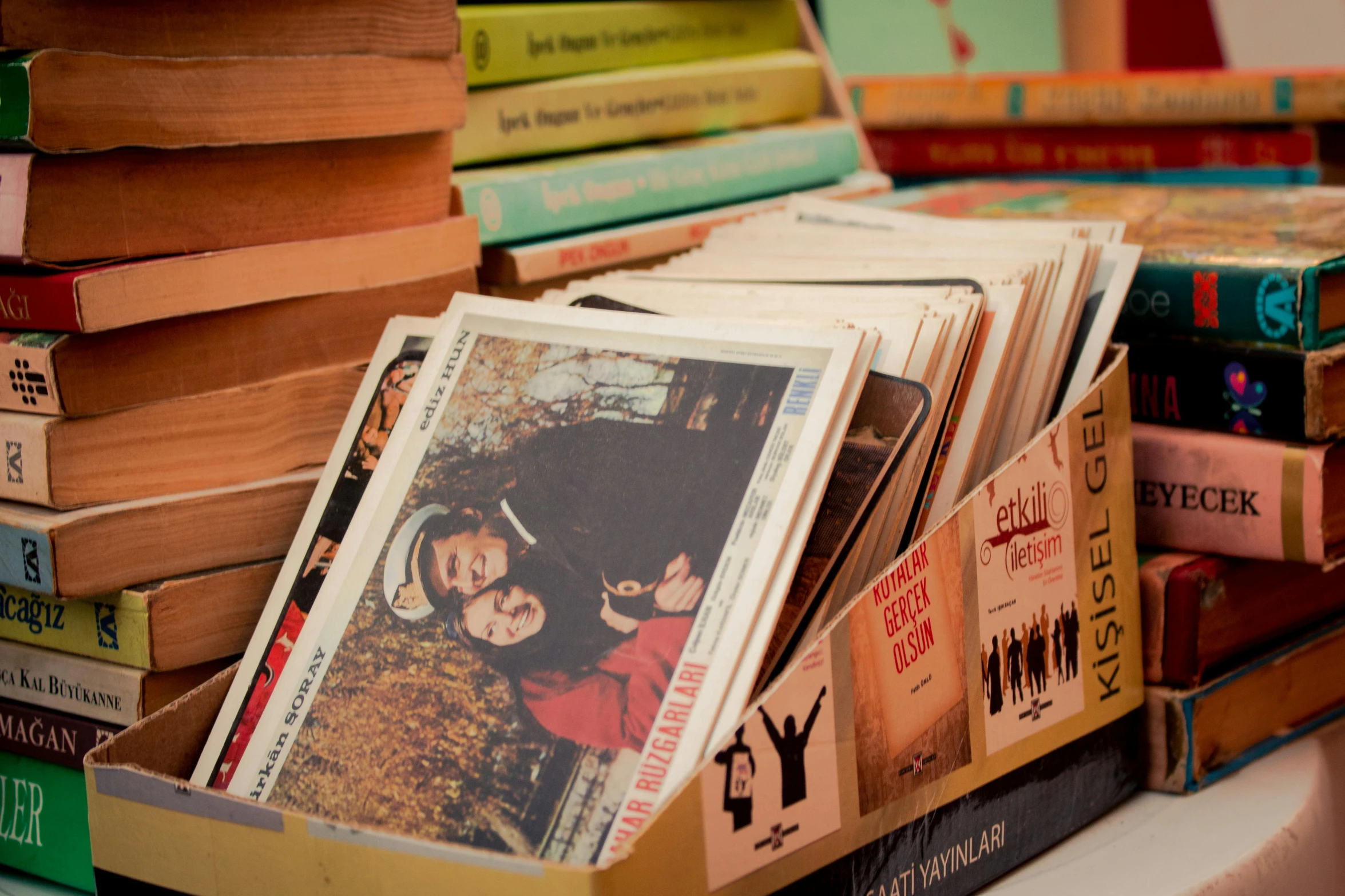 a bunch of books stacked on top of each other