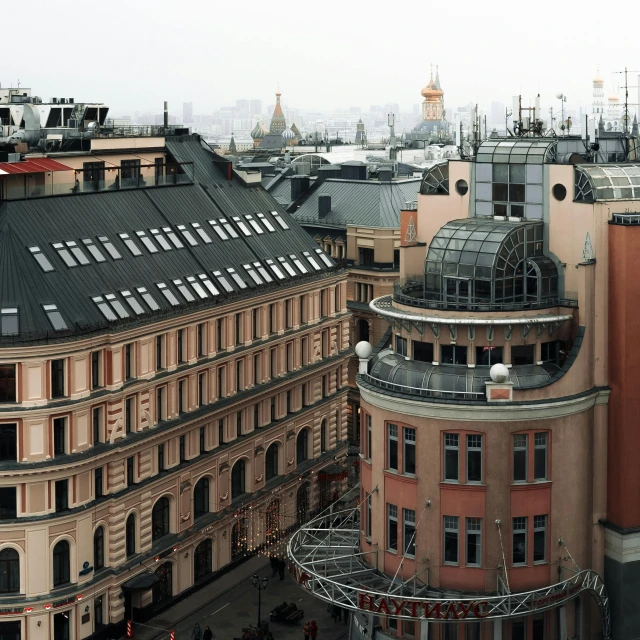 the roofs of buildings and the city's spires are tan