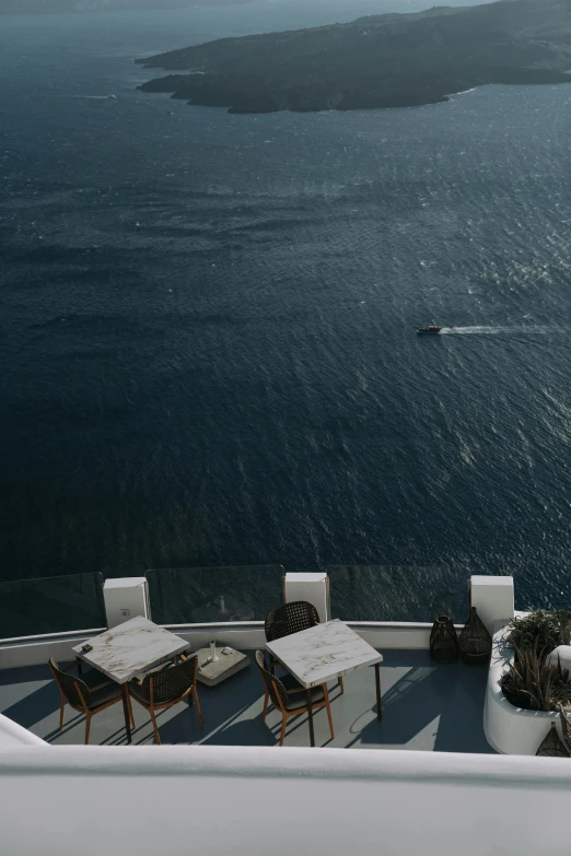 two chairs on a porch overlooking the water