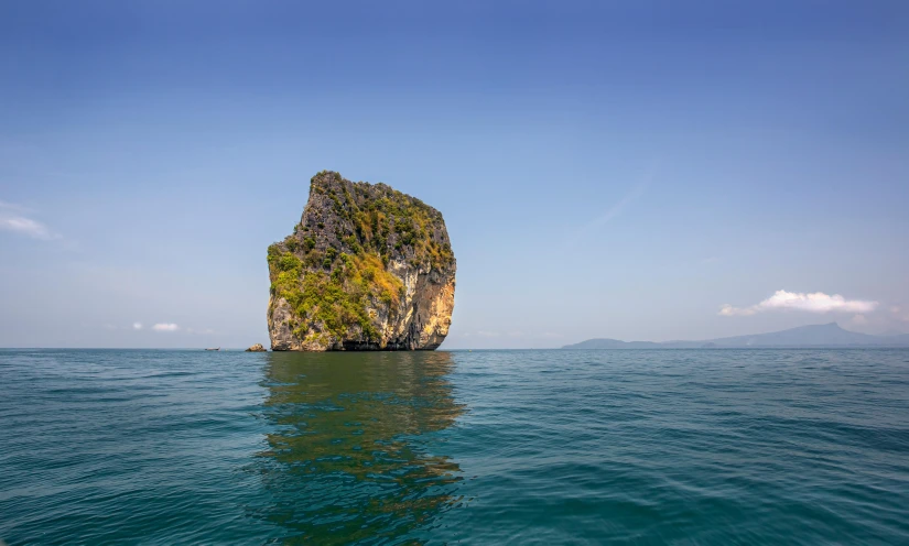 a rock out in the middle of the ocean