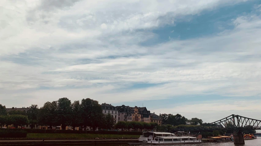 boats and vehicles are traveling on the river