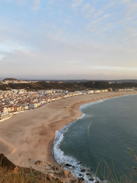 an image of a beach with some buildings in the background