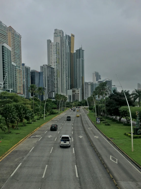 the traffic is traveling down the large empty road