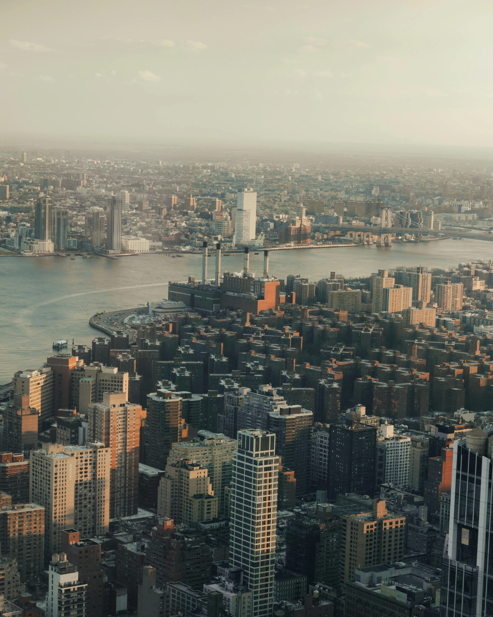 the city skyline is shown along with large buildings in the foreground