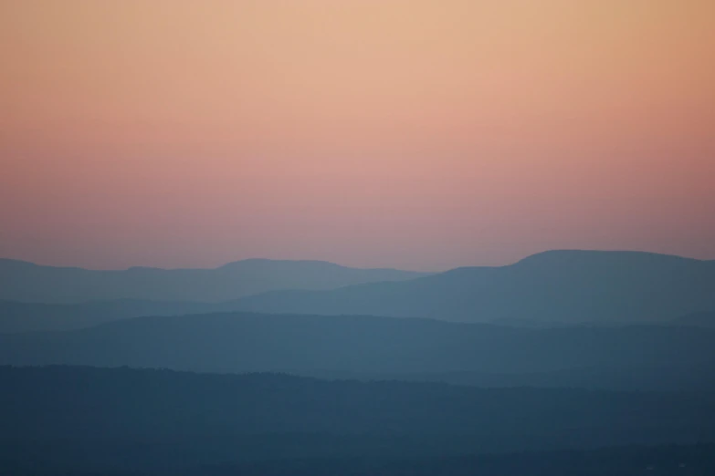 the hazy sky with hills in the background