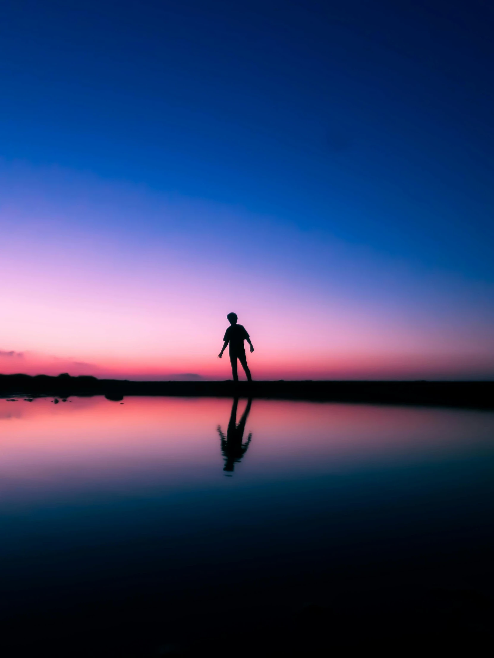 silhouettes of a man in an artistic setting with an purple hue