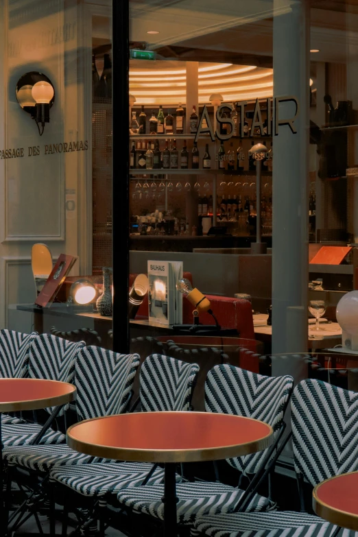 the back wall and tables are decorated with a black - and - white pattern