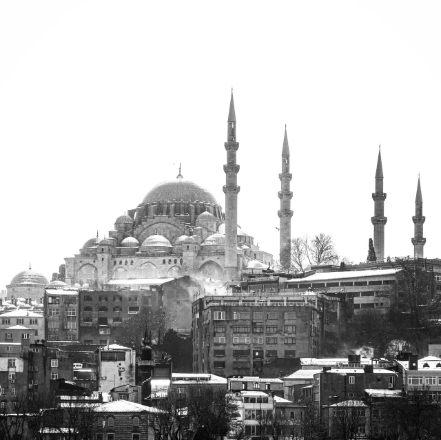 an old fashioned black and white po shows a mosque in the distance