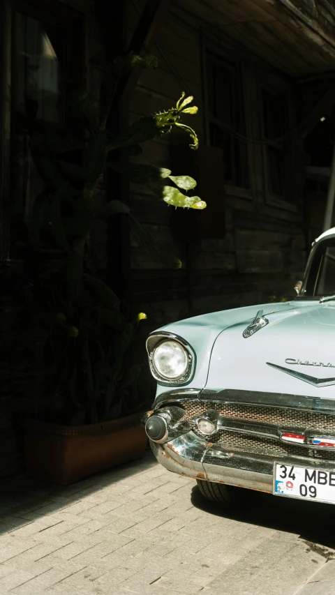 a car that is on the street in front of a building