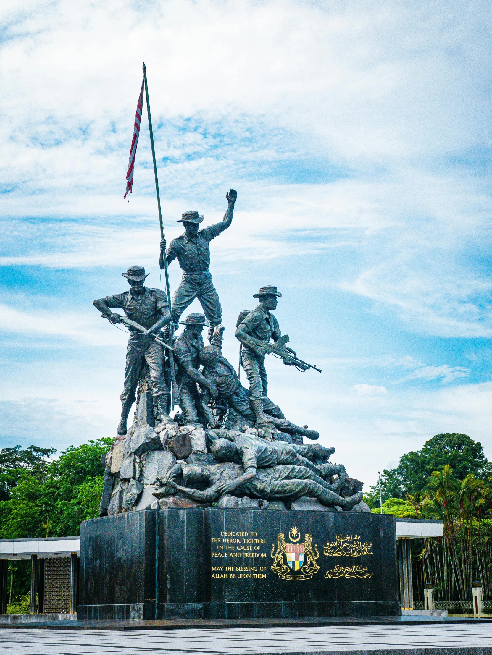 several military soldiers are displayed atop the monument