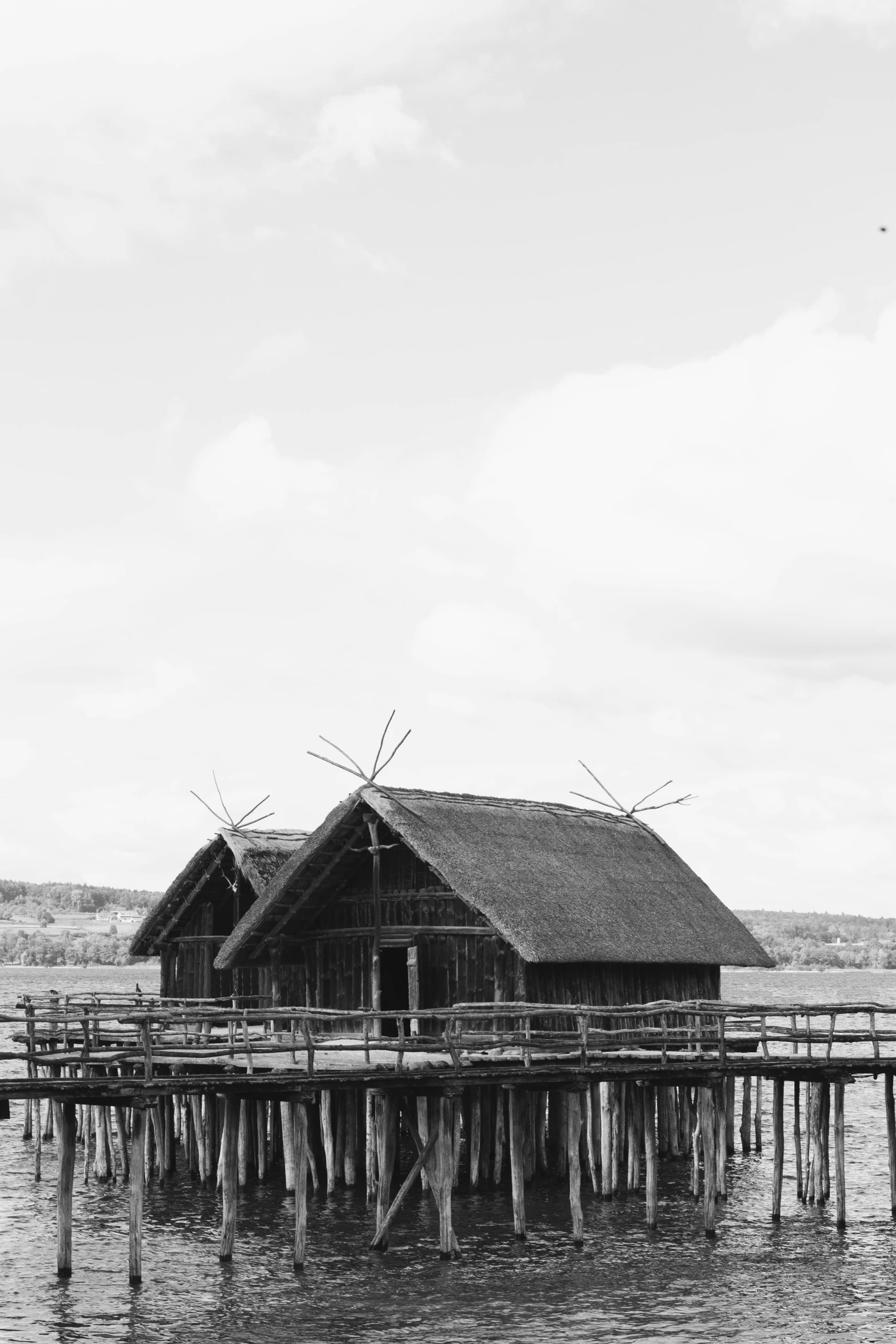 an old pier with houses sitting on top of it