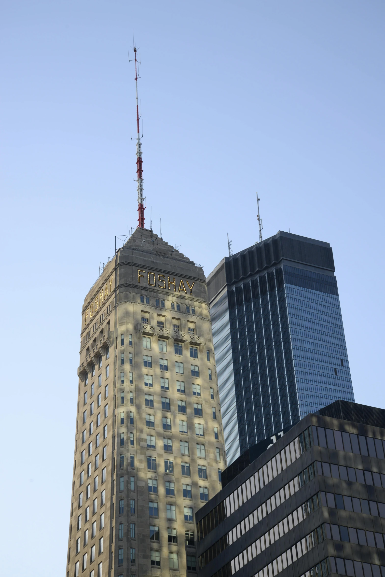 skyscrs line the side of an open - air city