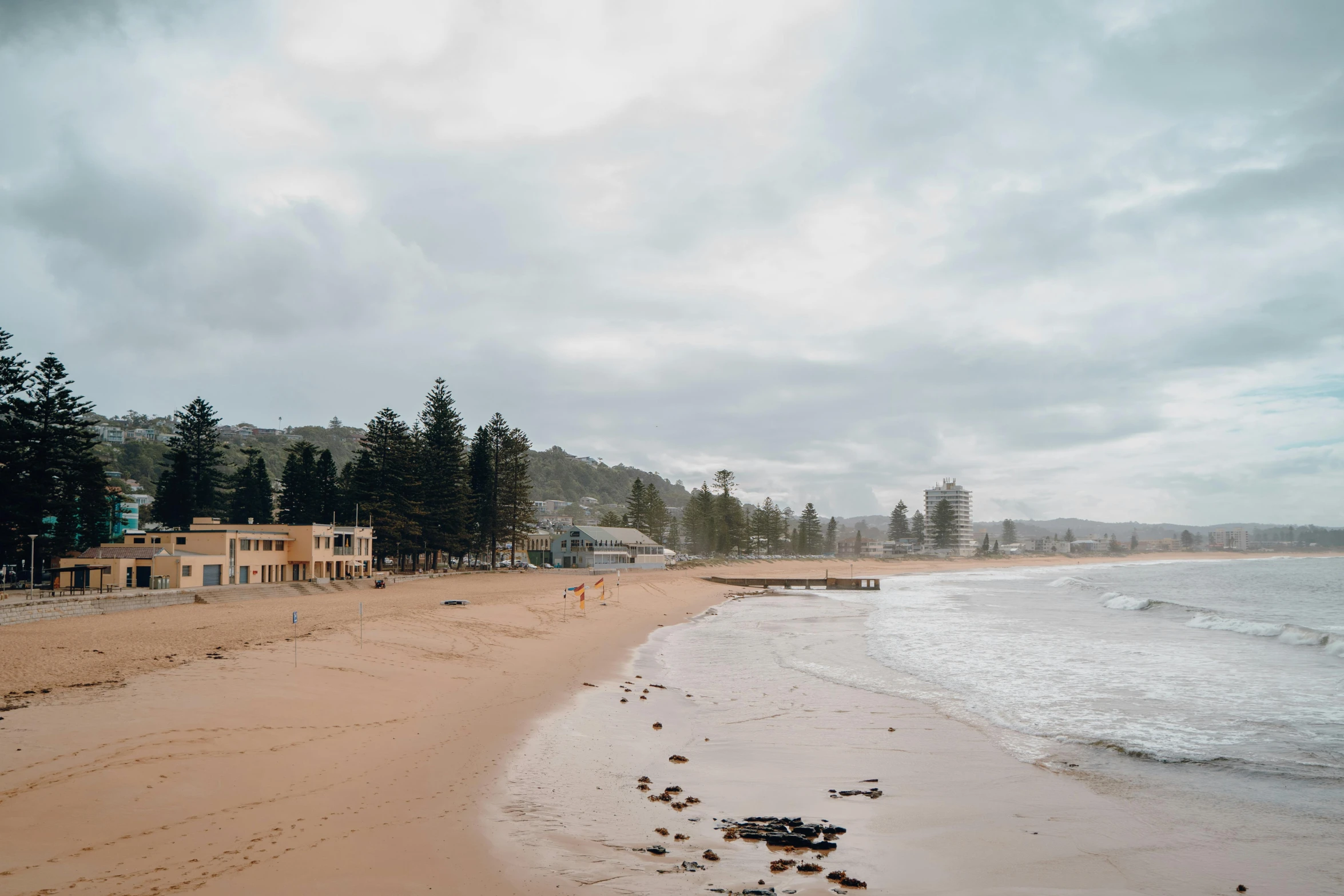 a beach has two homes and one oceanfront