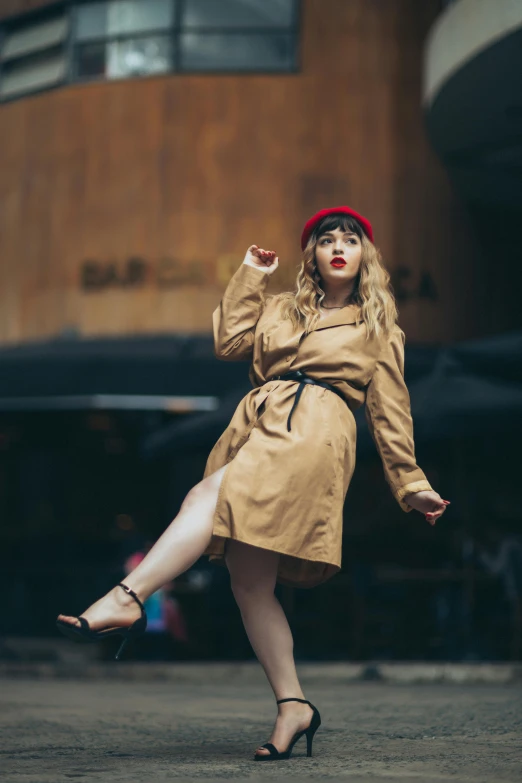 a woman with a red hat and glasses is holding her foot up