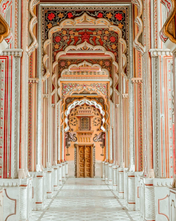 there is a doorway leading to another hall with beautiful carvings