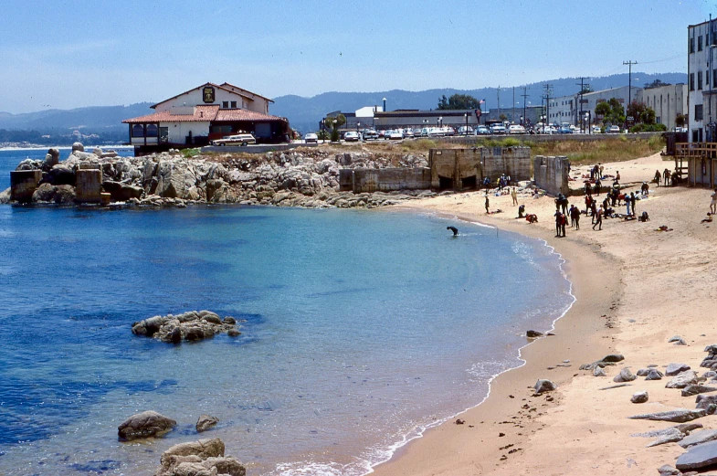 a view of the shoreline and people enjoying it